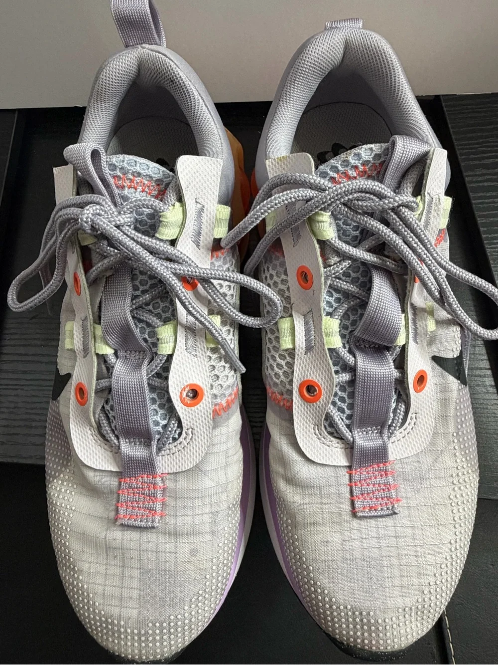 Nike Grey Athletic Sneakers with Black Swoosh and Orange Accents